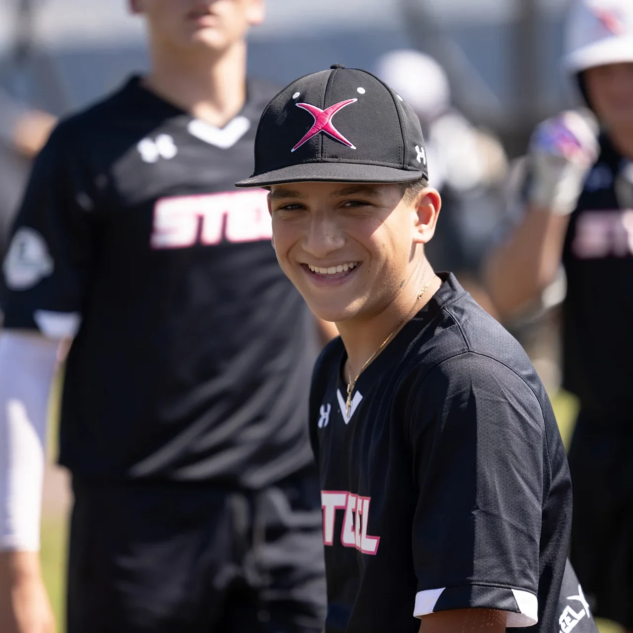 Team Steel baseball players in the dugout